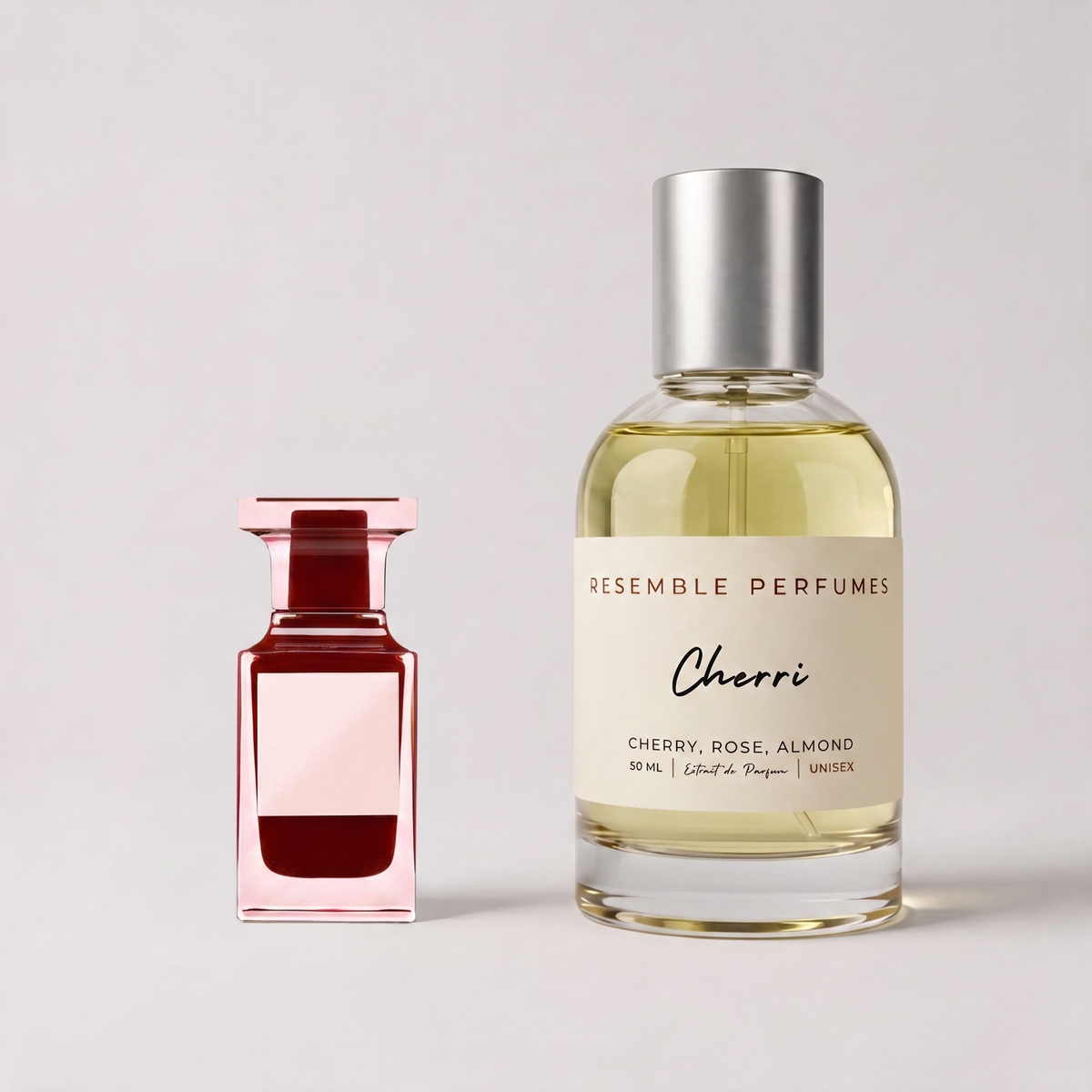 Cherri extrait de parfum by Resemble Perfumes beside the designer cherry fragrance that inspired it