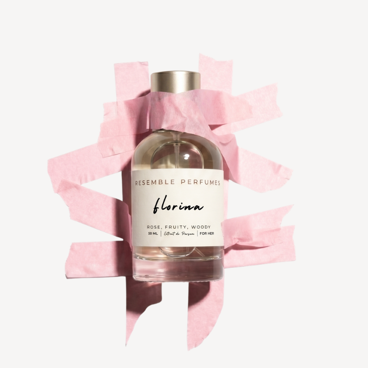 Florina extrait de parfum by Resemble Perfumes framed by torn pink paper