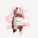 Florina extrait de parfum by Resemble Perfumes framed by torn pink paper